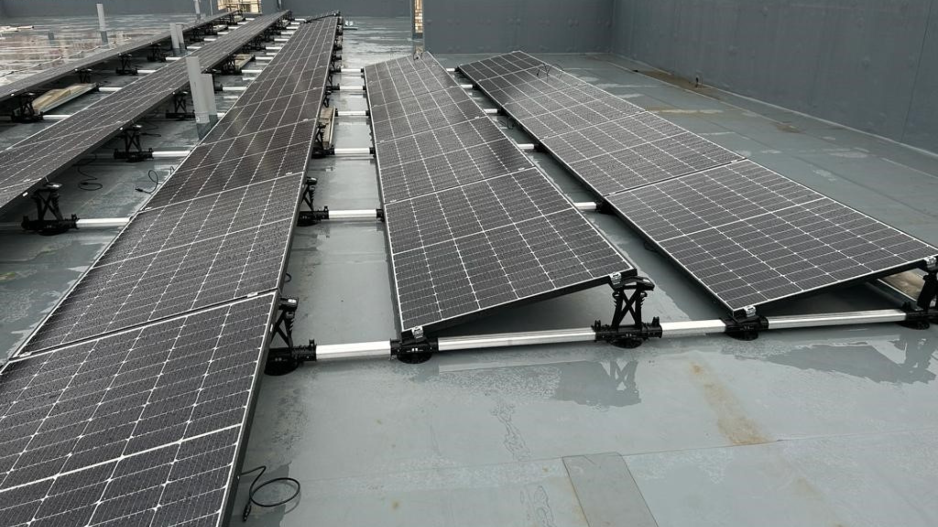 An image of a Solar PV flat roof install on a typical commercial property 